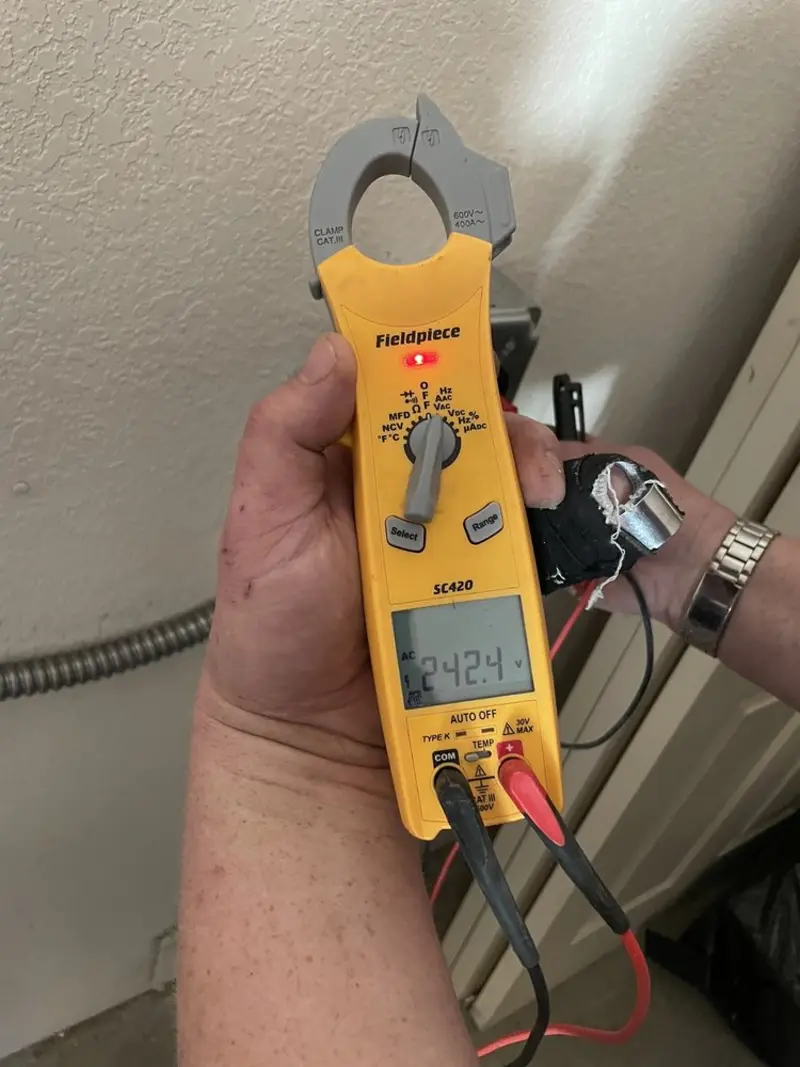 Voltage testing with clamp meter during Outlet Installation in Beachwood